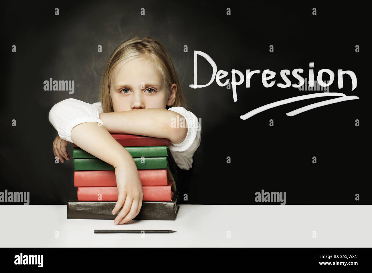 Tired child girl  with books. Depression concept Stock Photo
