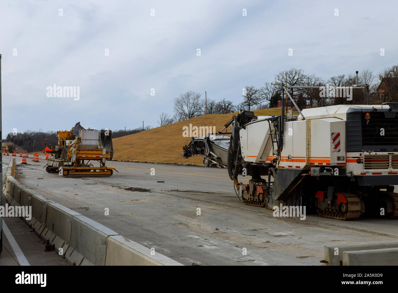 Road construction equipment are working on a new road construction