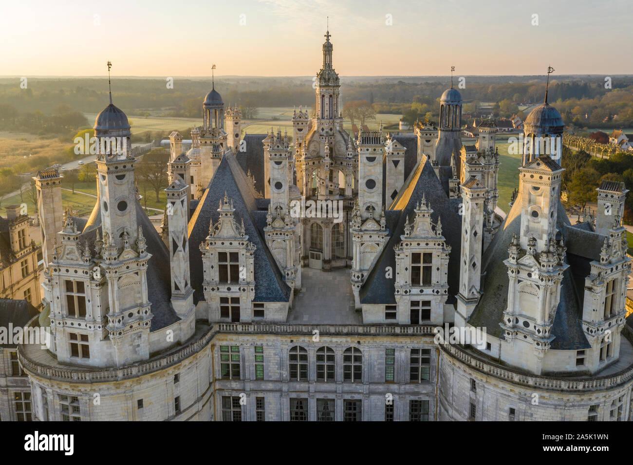 France, Loir et Cher, Loire Valley listed as World Heritage by UNESCO, Chambord, royal castle, views on the roofs and chimneys, sunrise (aerial view) Stock Photo