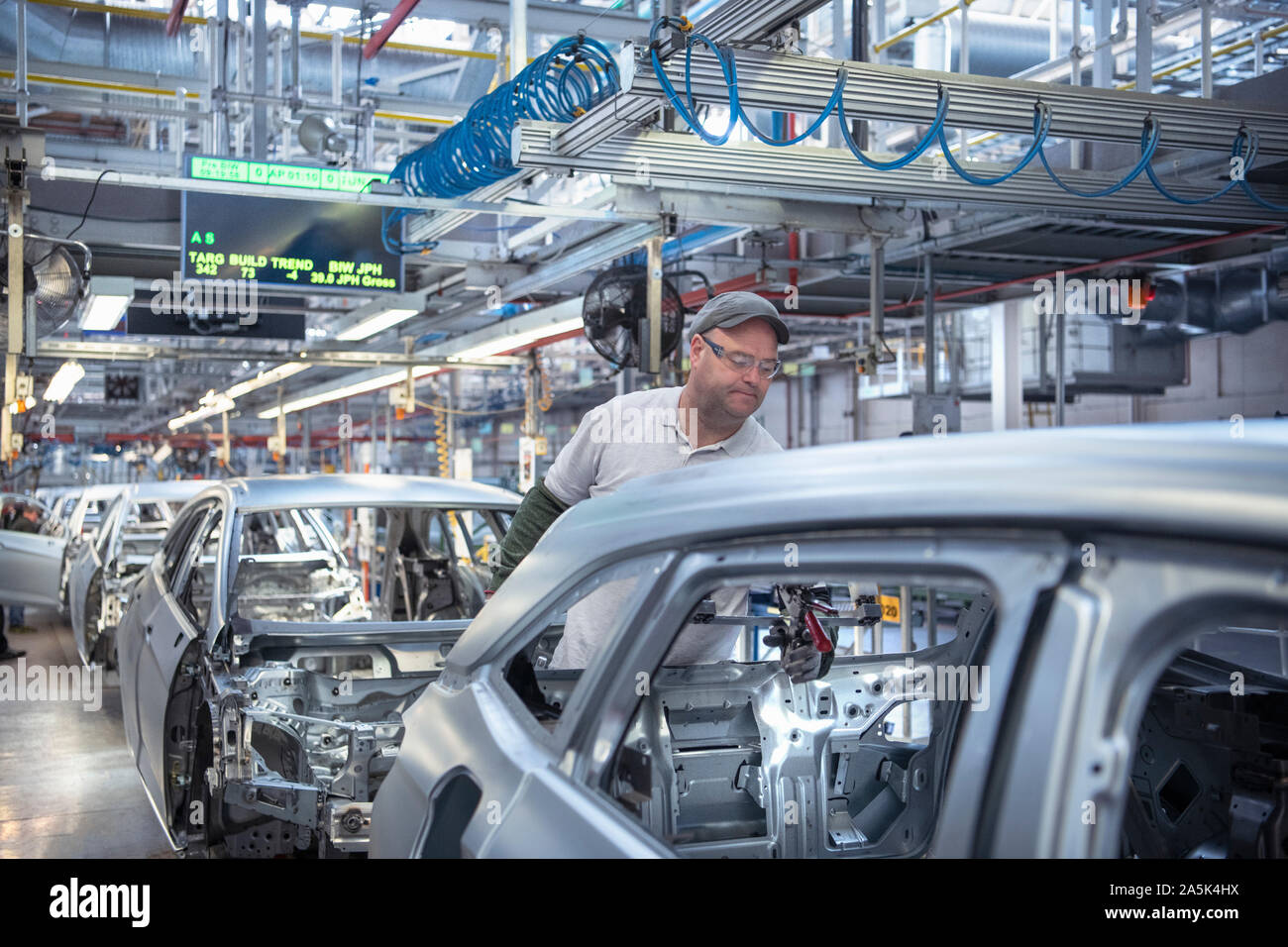Automotive assembly line workers hires stock photography and images
