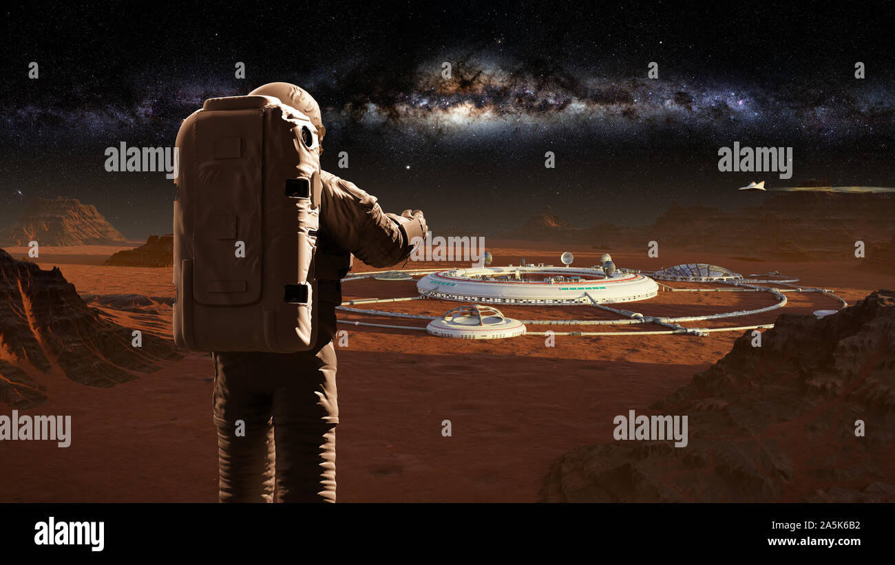 astronaut on planet Mars, looking at a martian city Stock Photo