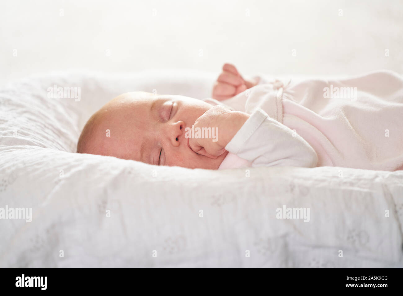 Baby sleeping on Ushaped pillow at home Stock Photo Alamy