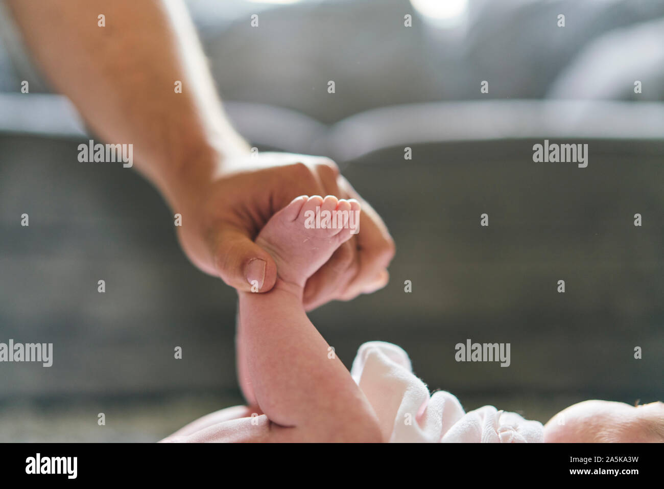 Father changing baby's diaper at home Stock Photo Alamy