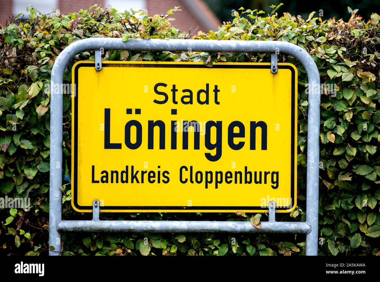 14 October 2019, Lower Saxony, Löningen: The town sign of the town Löningen in the district Cloppenburg at the entrance of the town. Photo: Hauke-Christian Dittrich/dpa Stock Photo