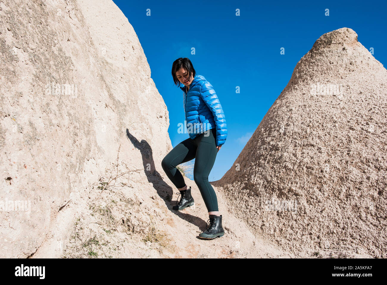 Woman exploring Uchisar Castle, Göreme, Cappadocia, Nevsehir, Turkey Stock Photo