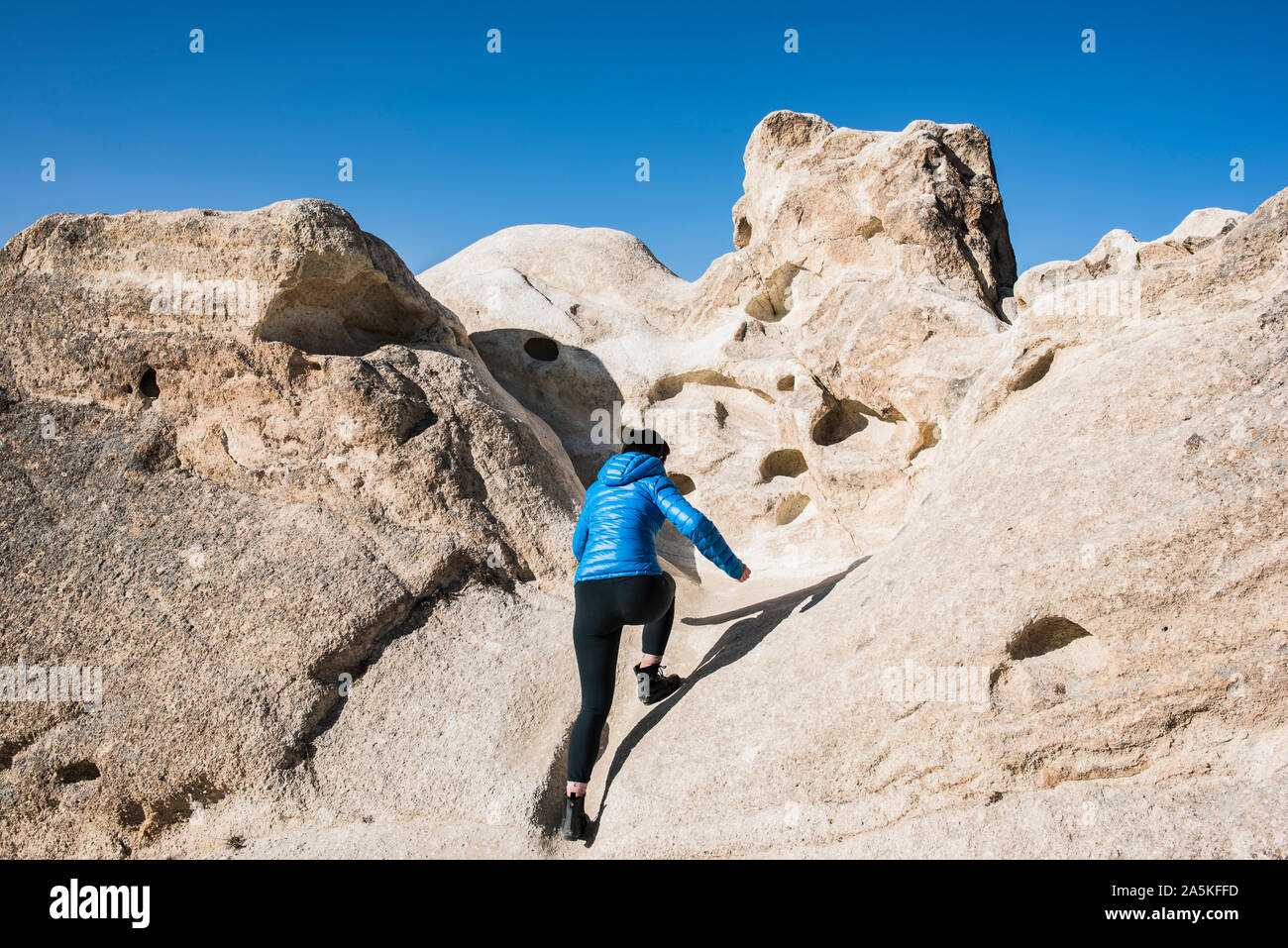 Woman exploring rock formations, Göreme, Cappadocia, Nevsehir, Turkey Stock Photo
