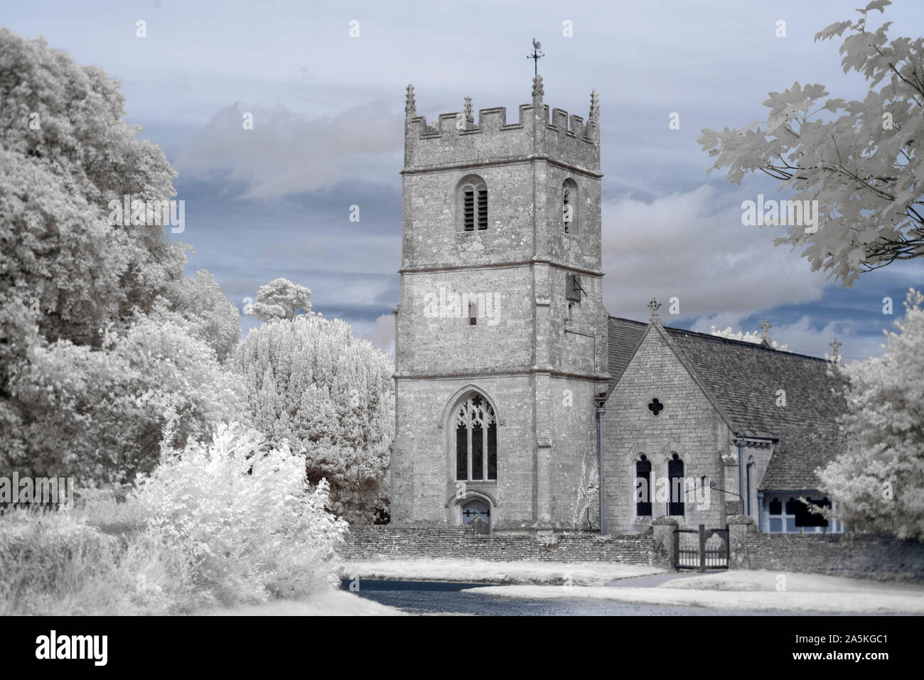Holy Trinity Church in the village of Long Newnton in rural Gloucestershire near Tetbury, shot in infrared light Stock Photo