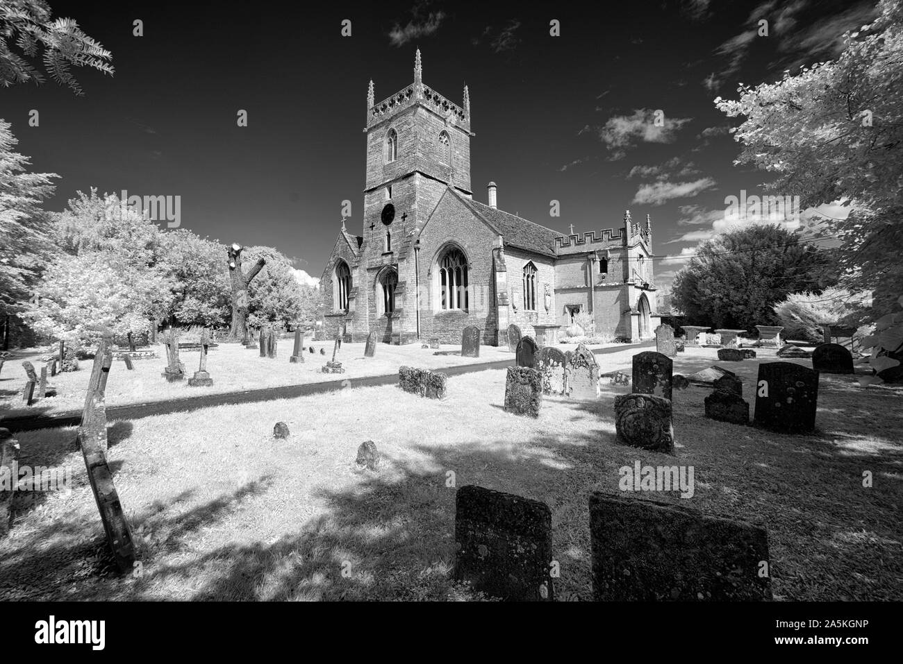 Black and white image of the grade 1 listed, Norman church of All Saints  in the Wiltshire village of Crudwell near Cirencester. Stock Photo