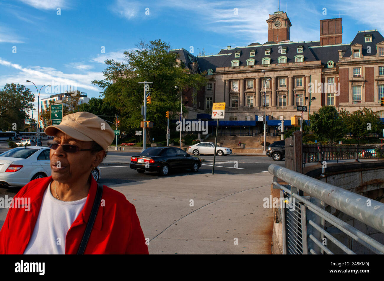 Local black people and low angle view of the landmarked Staten Island Borough Hall on Richmond Avenue Terrace, St. George, Staten Island, New York Cit Stock Photo