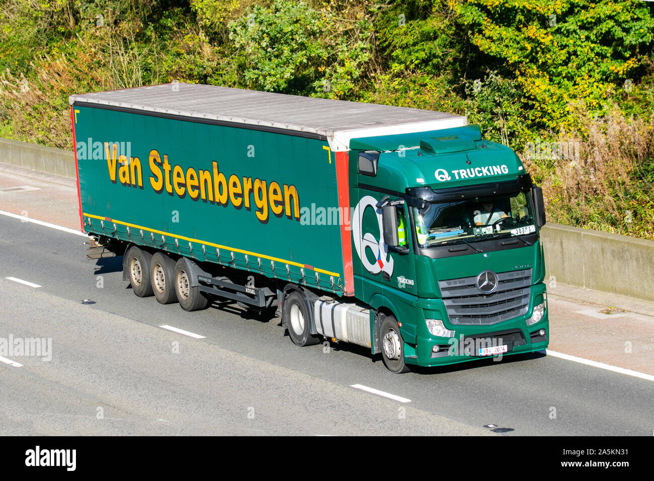 VAN STEENBERGEN Trucking; Haulage delivery trucks, haulage, lorry,  transportation, truck, cargo, green Mercedes Benz Actros vehicle, delivery,  transport, industry, supply chain freight, on the M6 at Lancaster, UK Stock  Photo - Alamy