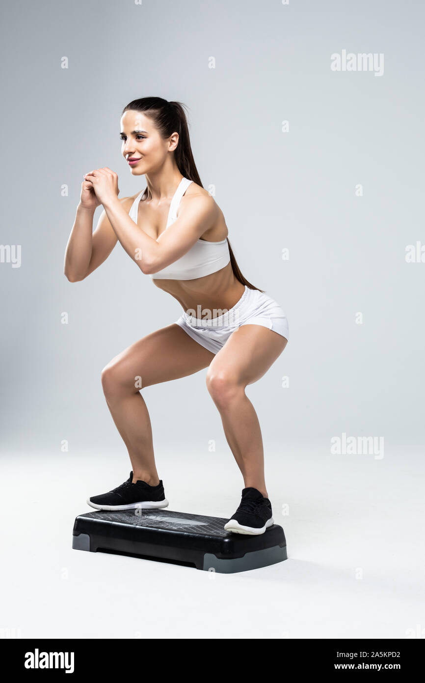 Fit woman in sportswear at step-aerobics class Stock Photo - Alamy