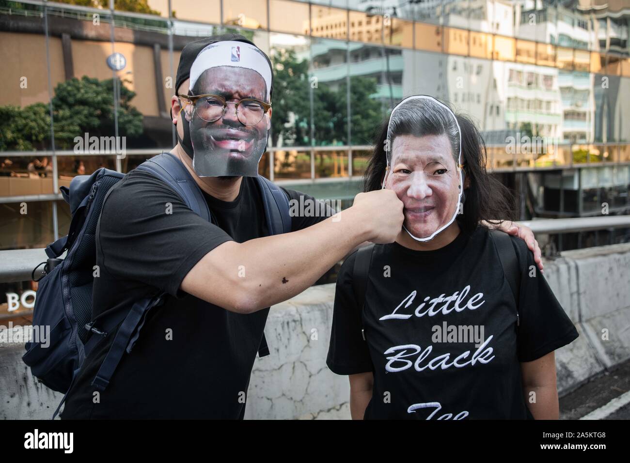 Hong Kong, China. 20th Oct, 2019. Protesters wearing masks of Chinese President Xi Jinping and North American basketball player Lebron James during the demonstration.Protesters defy demonstration ban, anti-mask law in Hong Kong and continue to protest across Hong Kong for the 20th consecutive week. After marching for few hours from Tsim Sha Tsui towards the speed train rail station, clashes between protesters and riot police occurred in different parts of Kowloon side. Credit: SOPA Images Limited/Alamy Live News Stock Photo