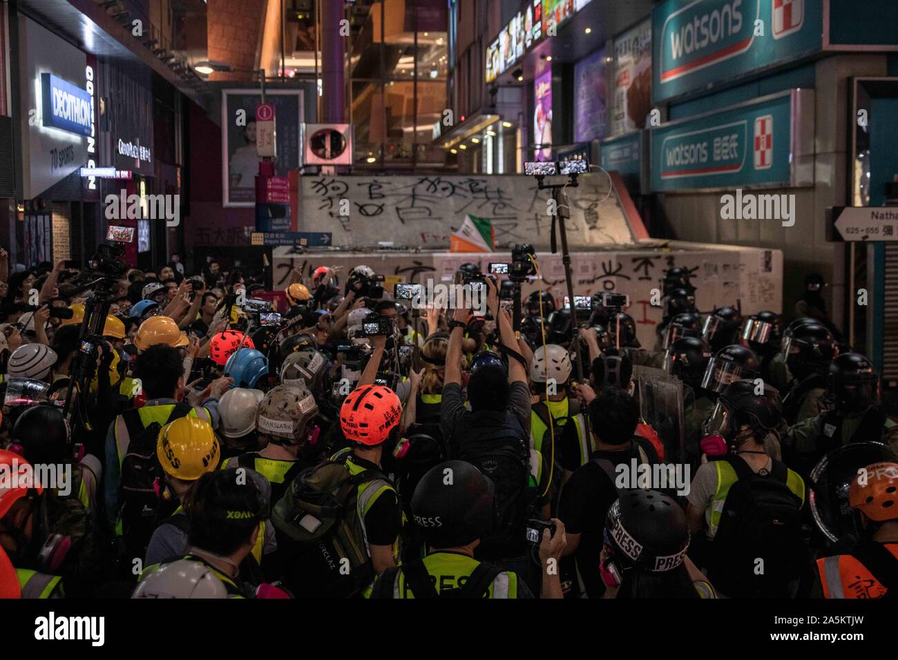 Hong Kong, China. 20th Oct, 2019. A group of journalists film riot police arresting protesters during the demonstration.Protesters defy demonstration ban, anti-mask law in Hong Kong and continue to protest across Hong Kong for the 20th consecutive week. After marching for few hours from Tsim Sha Tsui towards the speed train rail station, clashes between protesters and riot police occurred in different parts of Kowloon side. Credit: SOPA Images Limited/Alamy Live News Stock Photo