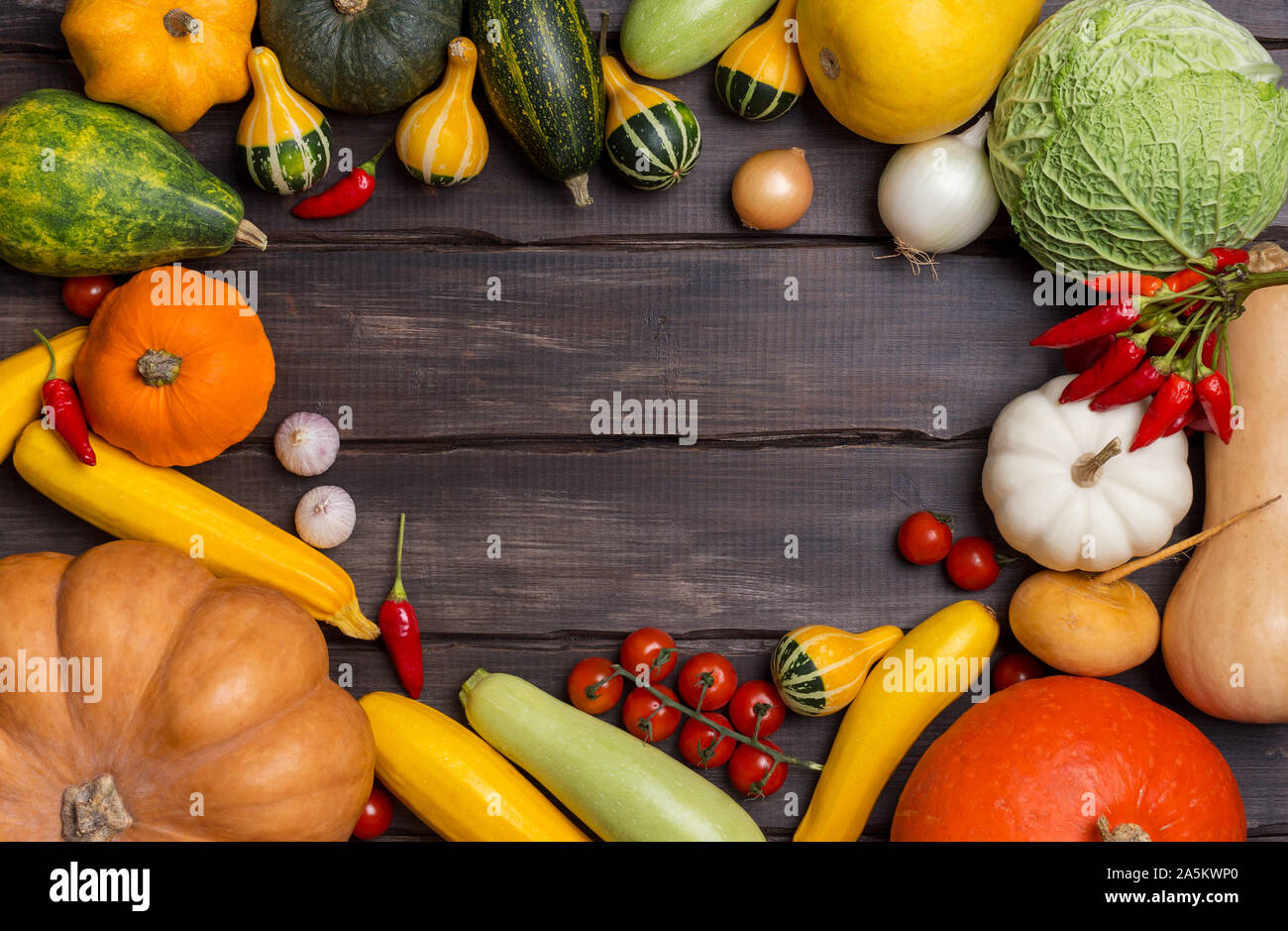 Copy space background with vegetables on dark wooden boards. Concept of harvest background. Flat lay, top view Stock Photo