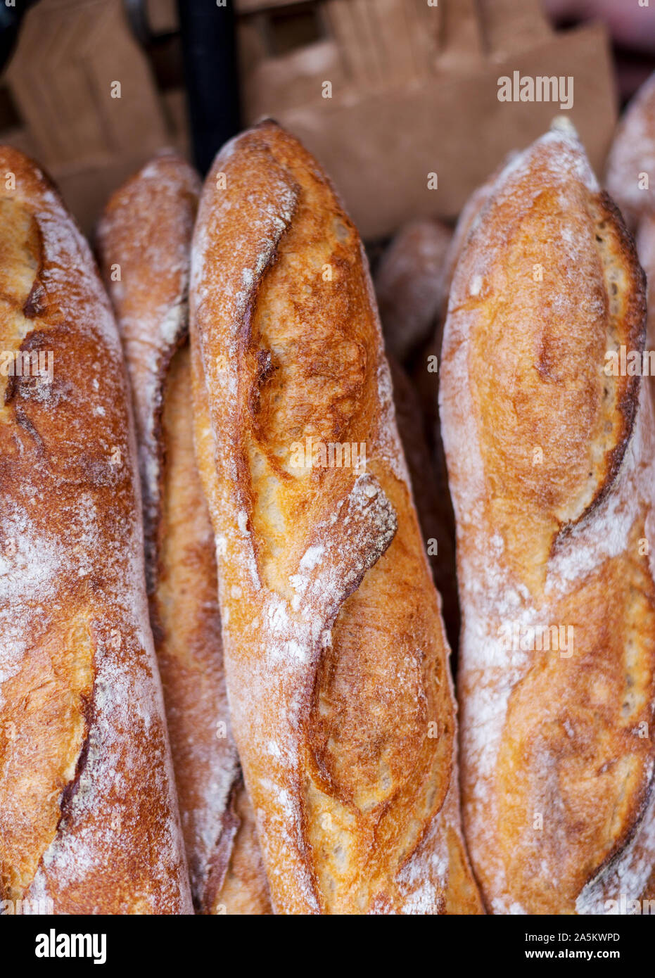 Fresh tasty Baguettes on street food market. Concept of french delicious food Stock Photo
