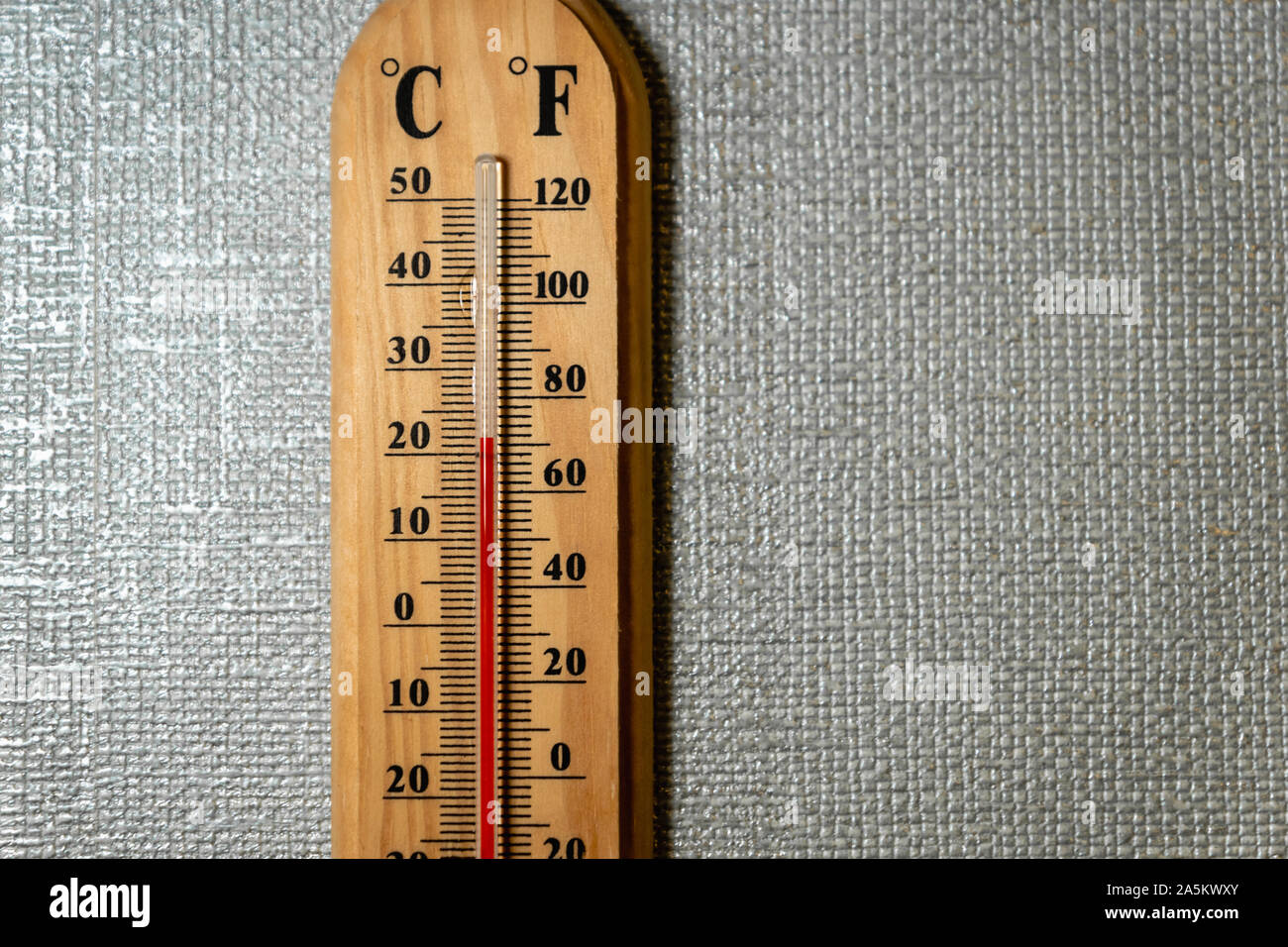 https://c8.alamy.com/comp/2A5KWXY/temperature-gauge-thermometer-on-the-white-wall-analog-temperature-gauge-close-up-2A5KWXY.jpg
