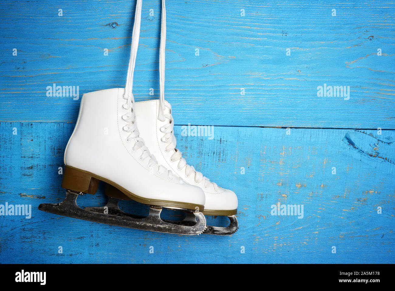 women figure ice skates hanging Stock Photo Alamy