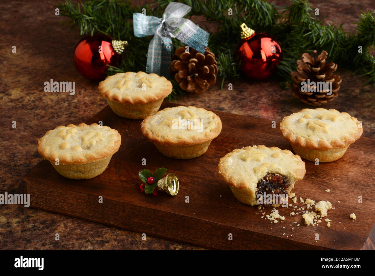 wood platter of christmas mincemeat pies Stock Photo