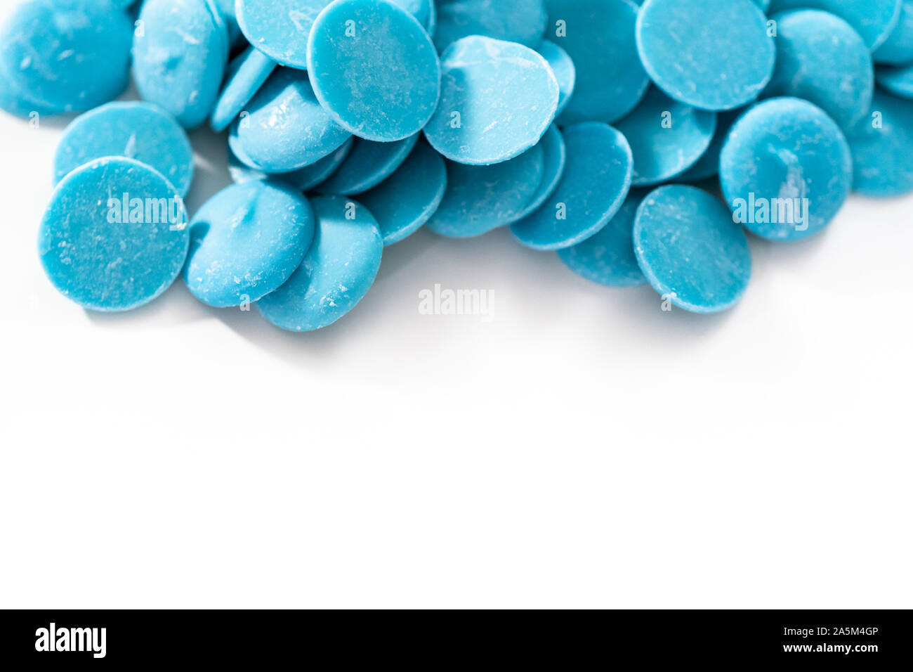 Blue round chocolate chips for melting chocolate shapes Stock Photo Alamy