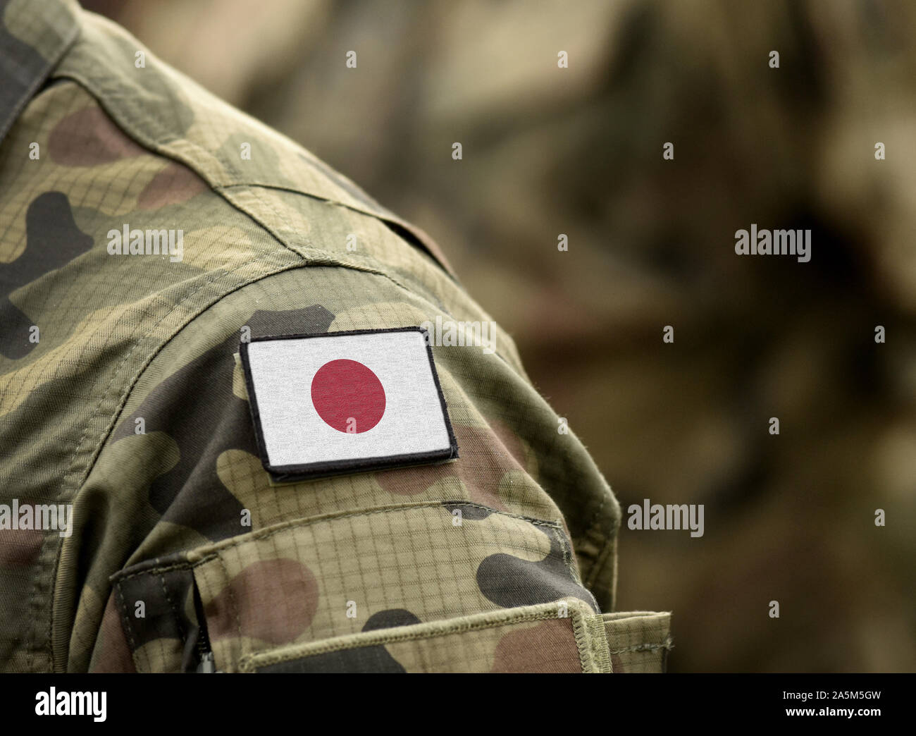 Flag of Japan on military uniform. Army, troops, soldier (collage). Stock Photo