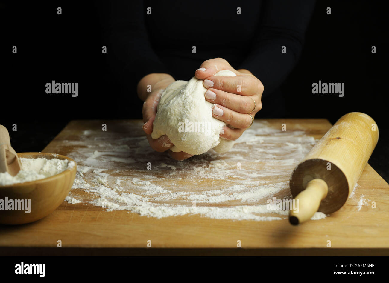 Preparing Traditional Homemade Dough Close Up View Of Woman Hands Kneading Fresh Dough For Making Bread Or Pizza On A Floured Table Stock Photo Alamy