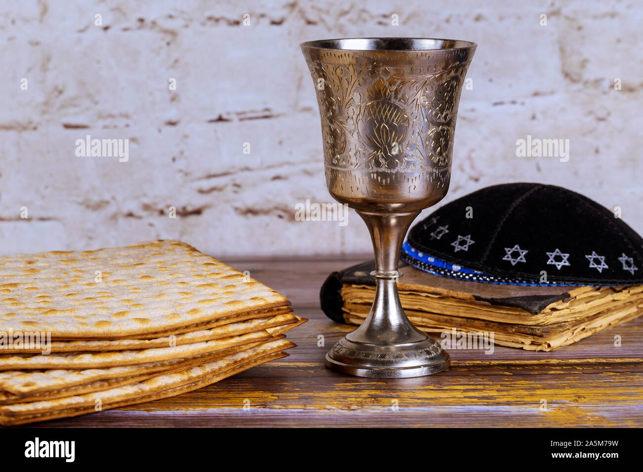 holiday jewish passover bread matzoh wine celebration and kipah Stock Photo