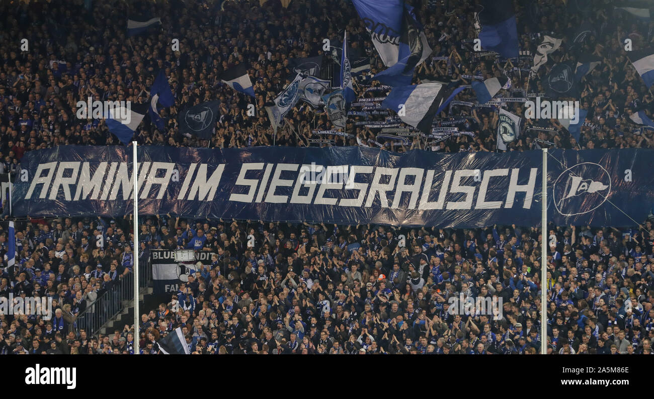 Bielefeld, Germany. 21st Oct, 2019. Soccer: 2nd Bundesliga, Arminia Bielefeld - Hamburger SV, 10th matchday in the Schüco Arena. Bielefeld's fans are showing a banner 'Arminia in a frenzy of victory'. Credit: Friso Gentsch/dpa - IMPORTANT NOTE: In accordance with the requirements of the DFL Deutsche Fußball Liga or the DFB Deutscher Fußball-Bund, it is prohibited to use or have used photographs taken in the stadium and/or the match in the form of sequence images and/or video-like photo sequences./dpa/Alamy Live News Stock Photo