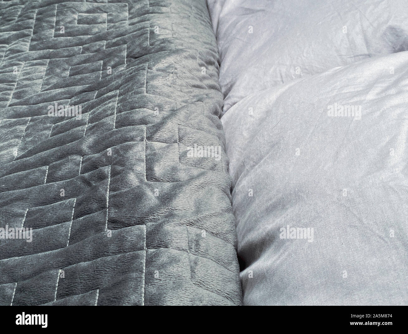 Still life of gray, weighted, blanket in bedroom Stock Photo Alamy