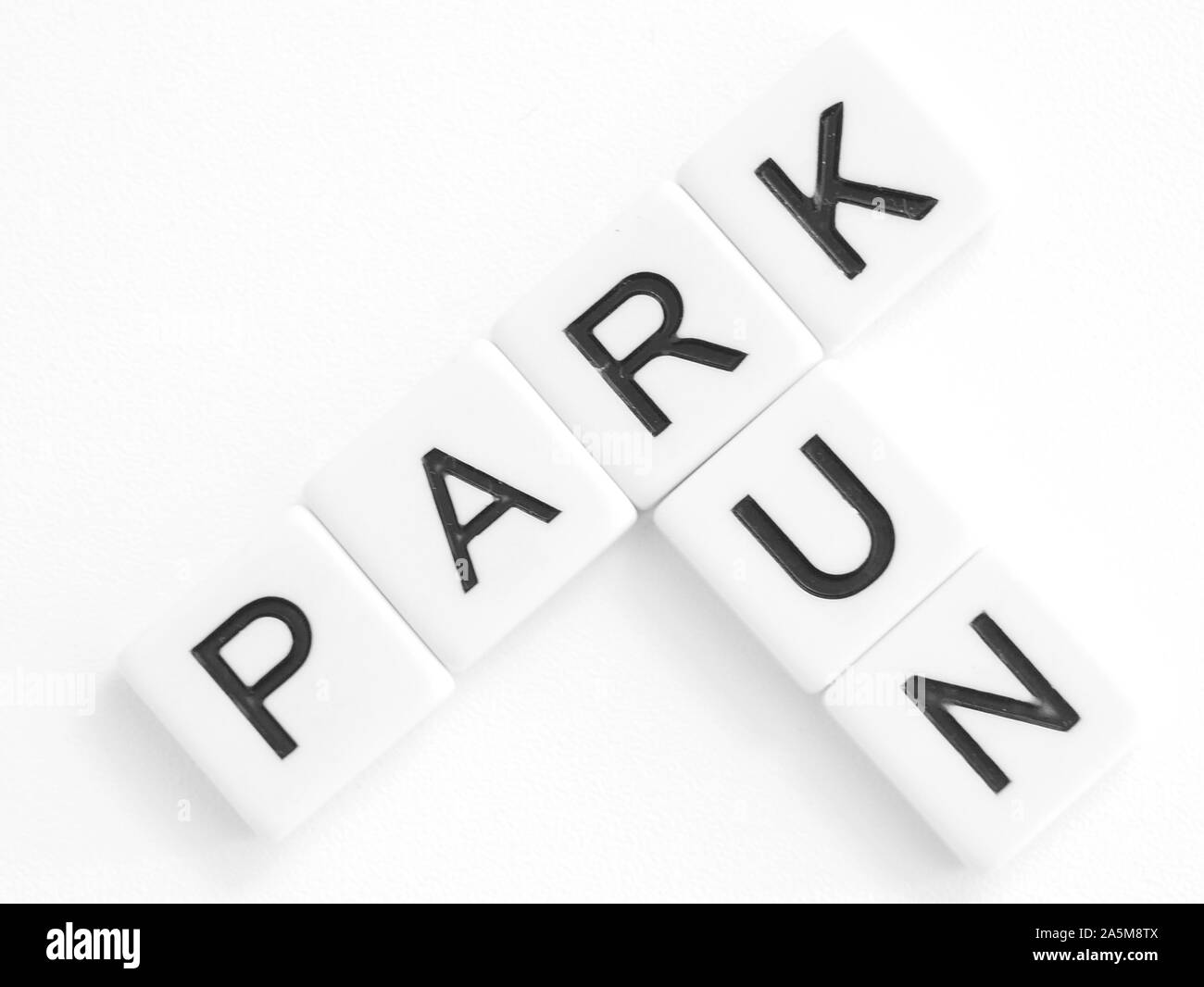 Words park and run in crossword style in black lettering on white tiles Stock Photo