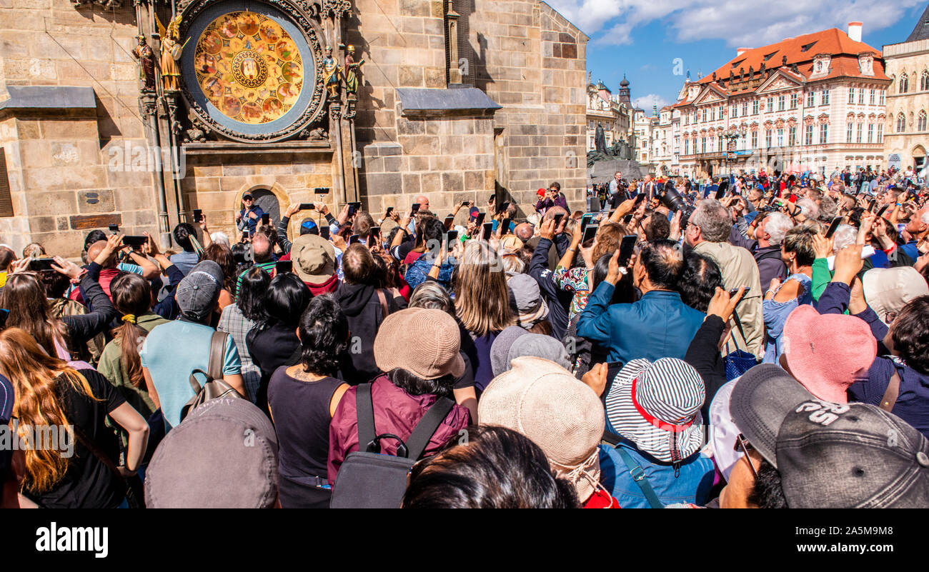 Tourists taking photograph of Astronomical Clock, Old Town Square, Prague, Czech Republic Stock Photo