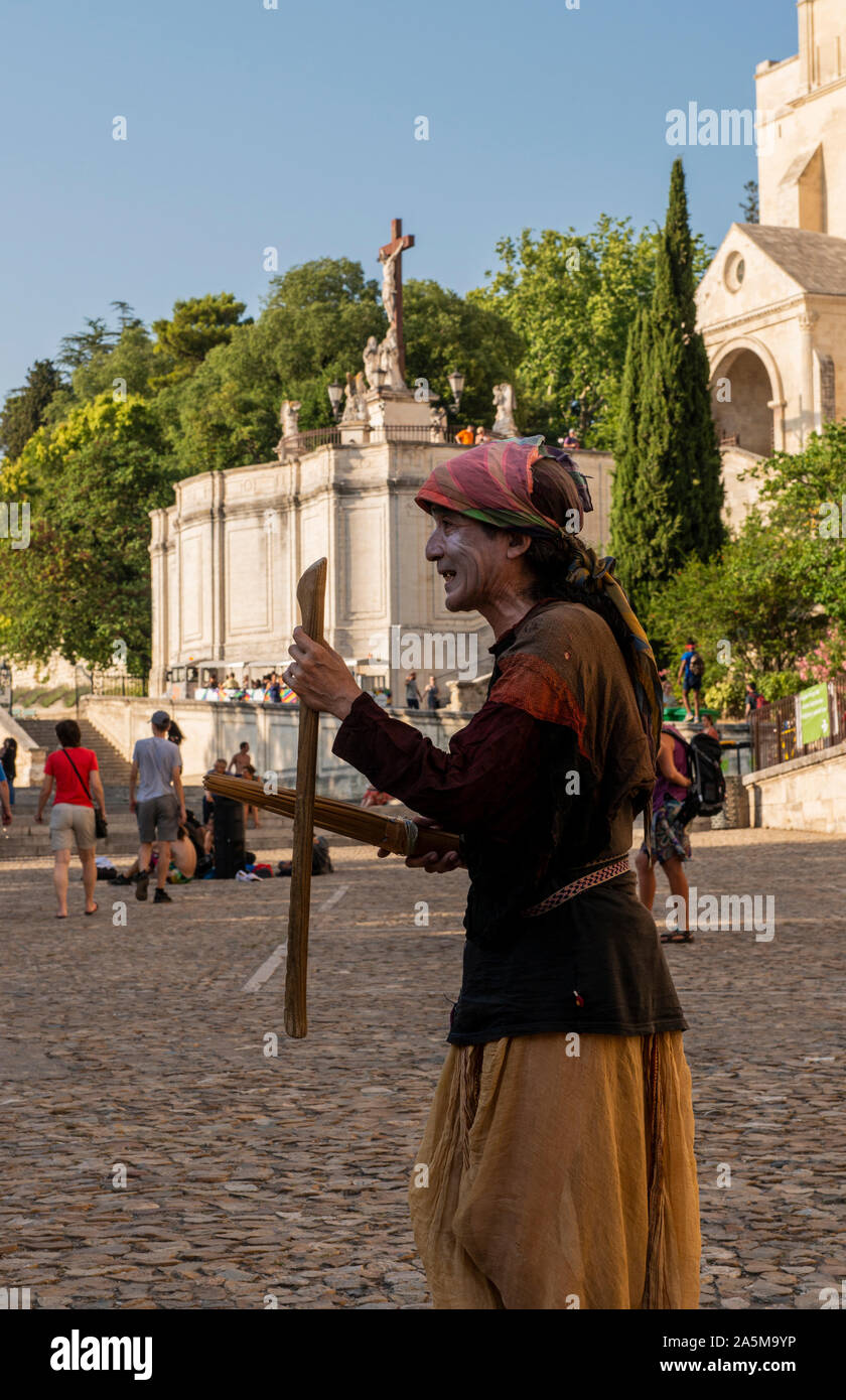 Vagrant wandering in square, Avignon Notre Dame Cathedral & Square, Avignon, Provence, France Stock Photo