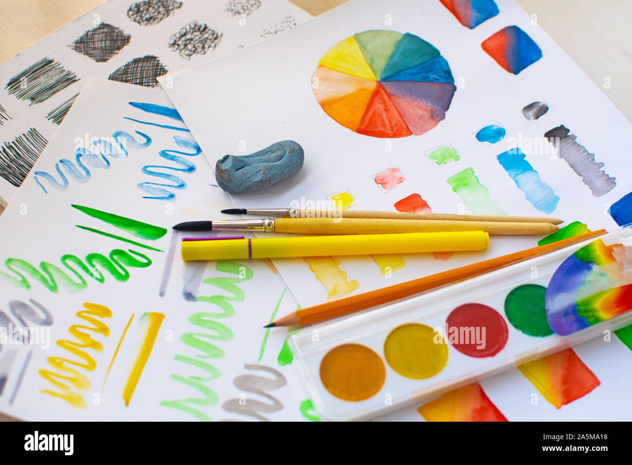 The sheet with exercises watercolor mixing, color wheel and hatching