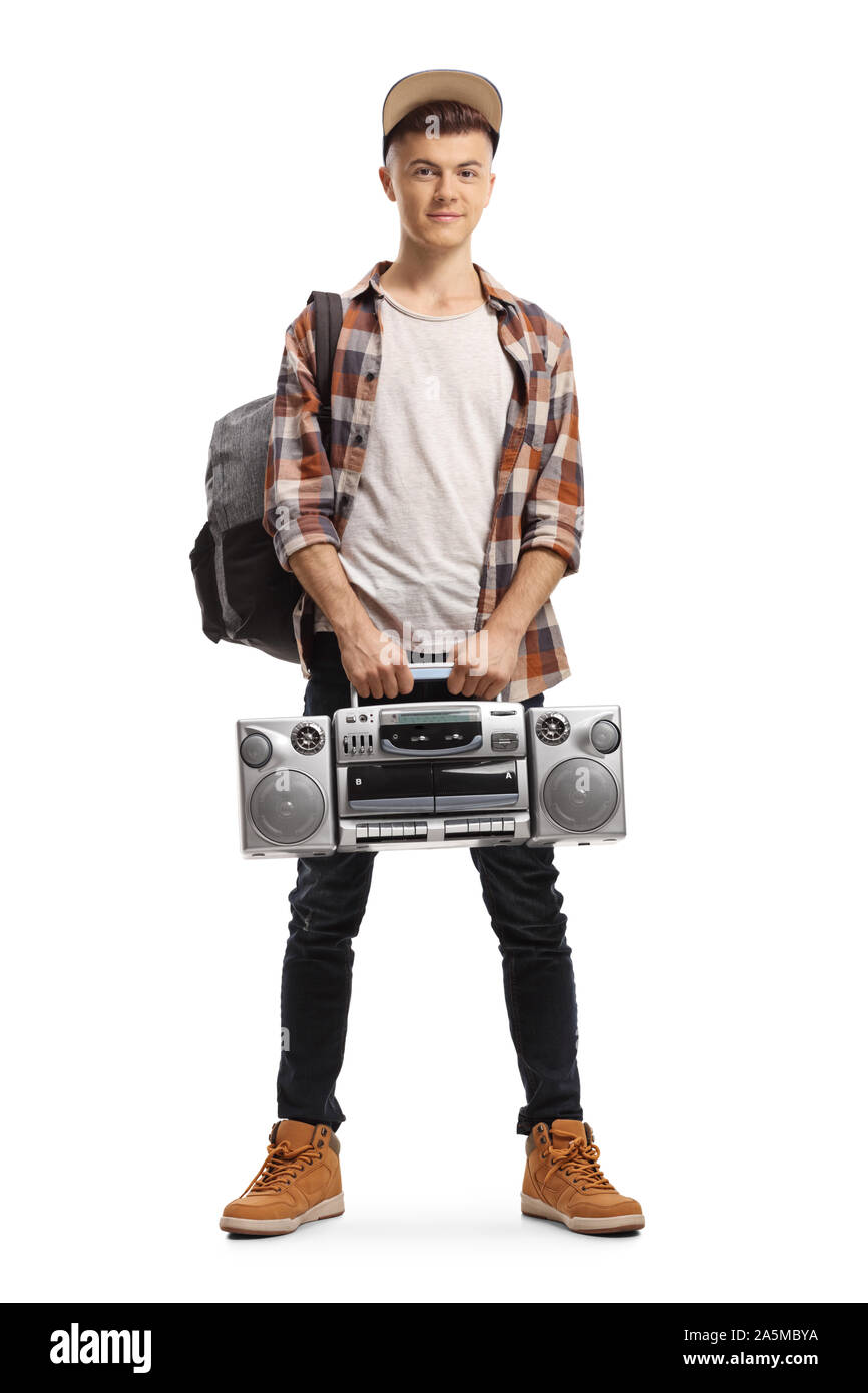 Full length portrait of a male teenager holding a boombox radio isolated on white background Stock Photo
