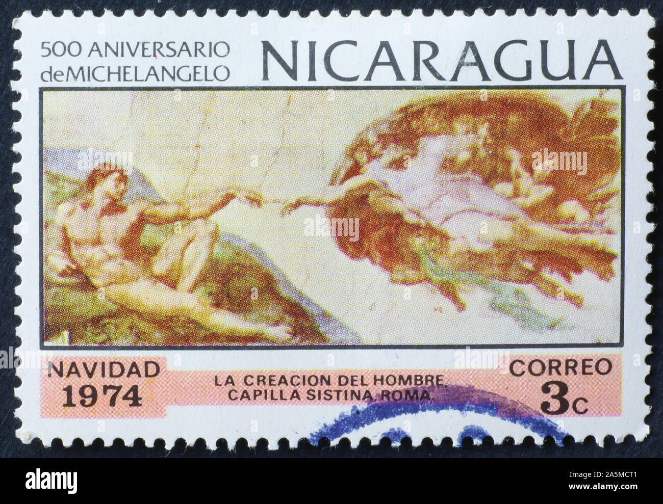 Creation of man by Michelangelo on postage stamp of Nicaragua Stock Photo