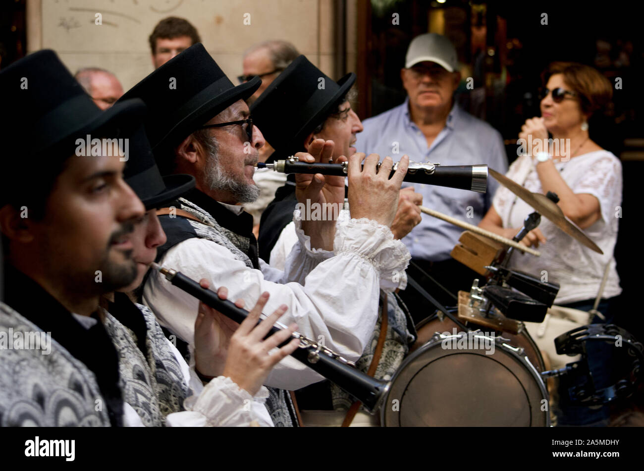 Men playing instruments at the Giants Parade during La Merce Festival 2019 at Placa de Sant Jaume in Barcelona, Spain Stock Photo