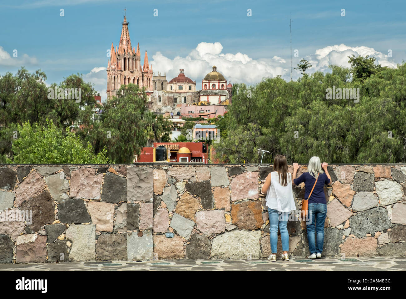 Domes and spires of the Parroquia San Miguel Arcangel church viewed from Instituto Allende in the historic district of San Miguel de Allende, Mexico. Stock Photo