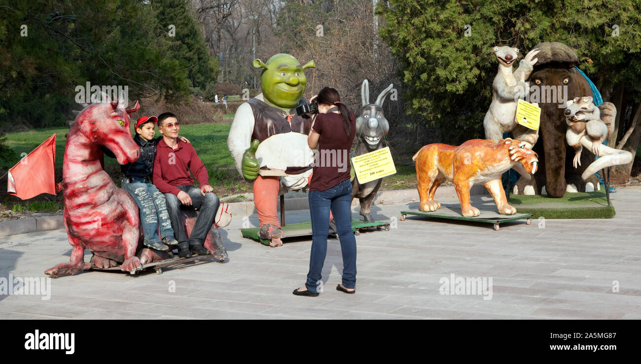 ALMATY - Figures from famous animation movies at the entrance of Gorky Park Stock Photo