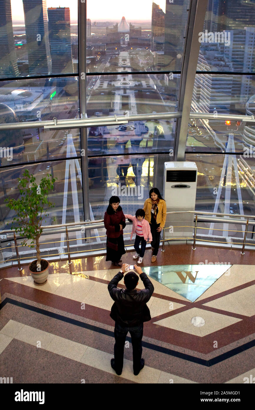 NUR-SULTAN - Visitors taking photos on the observation deck of the Bayterek tower Stock Photo