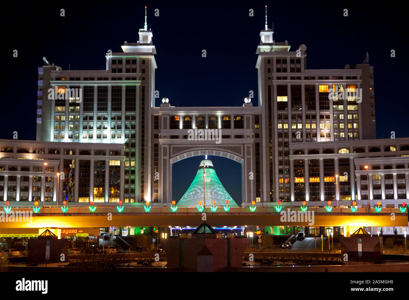 NUR-SULTAN - Nurzhol boulevard with Khan Satyr entertainment center at night Stock Photo