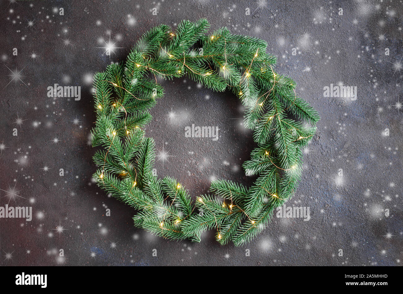 Christmas door wreath made of tree fir branches with xmas lights on ...