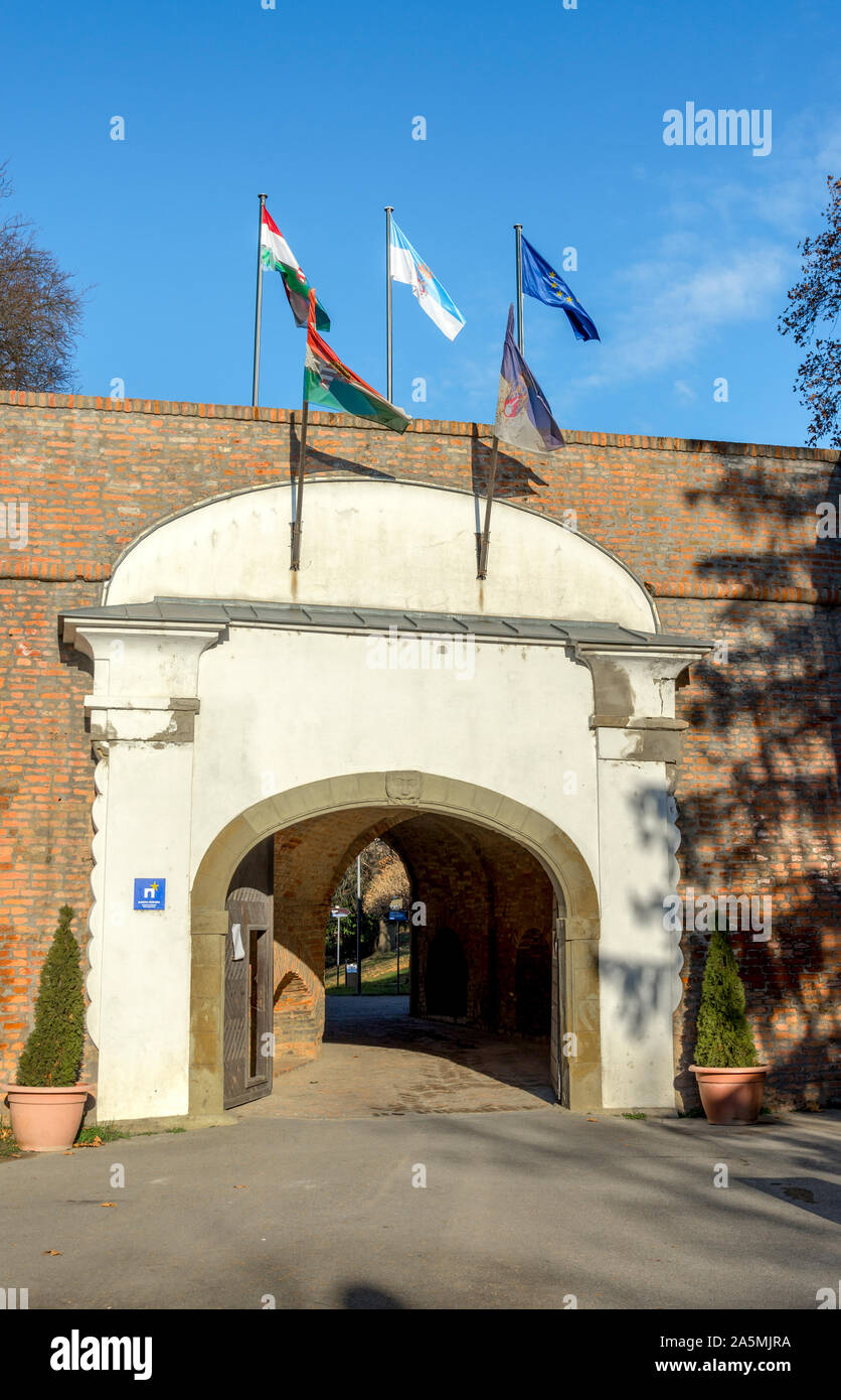 Flags at the entrance gate to Zrinyi Castle, Szigetvar, Hungary Stock Photo
