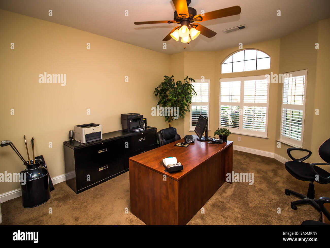 Home Office With Wooden Desk, File & Office Equipment Stock