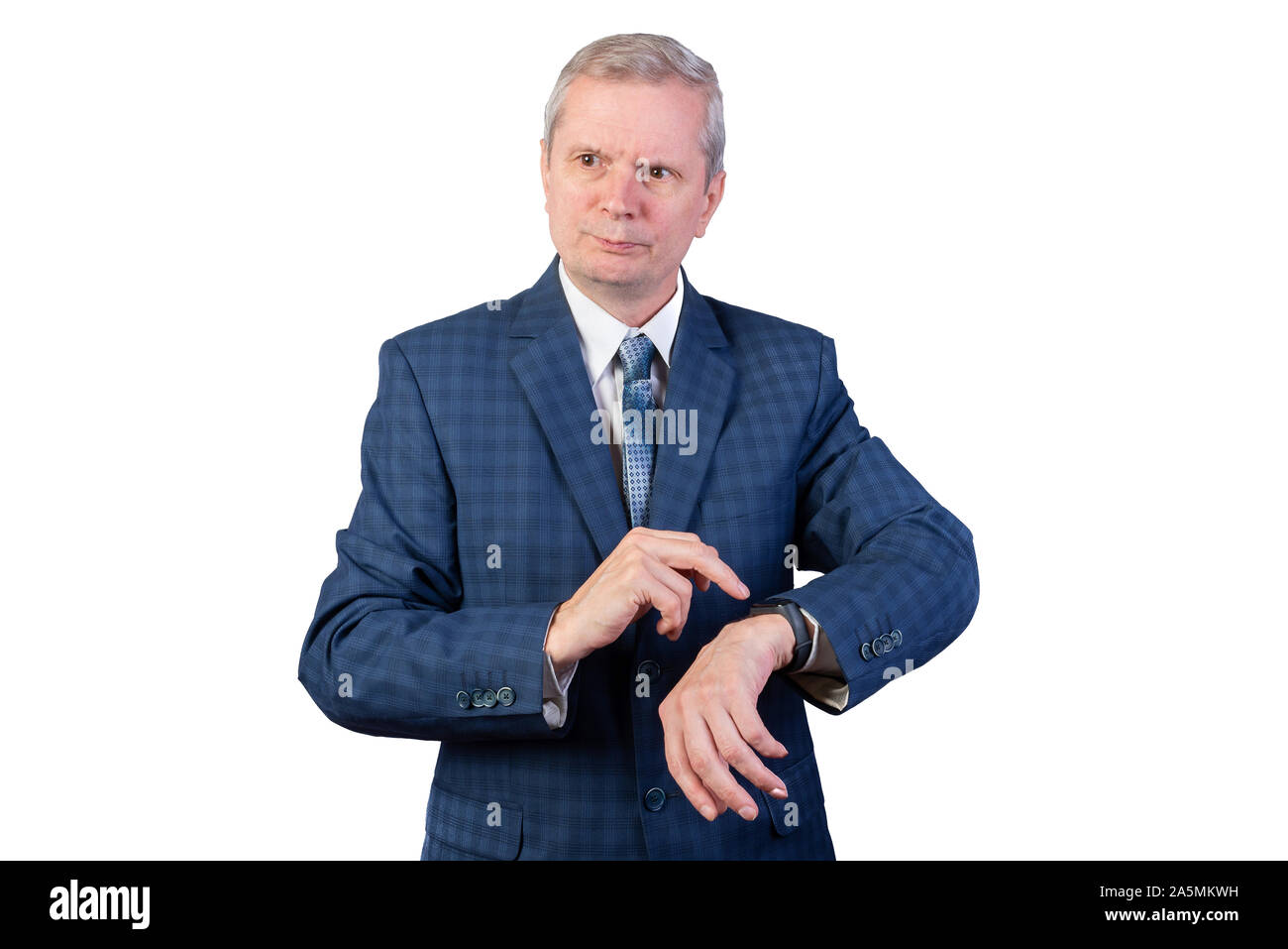 An elderly man in a suit measures the pulse of a fitness bracelet. Isolated on a white background. Stock Photo