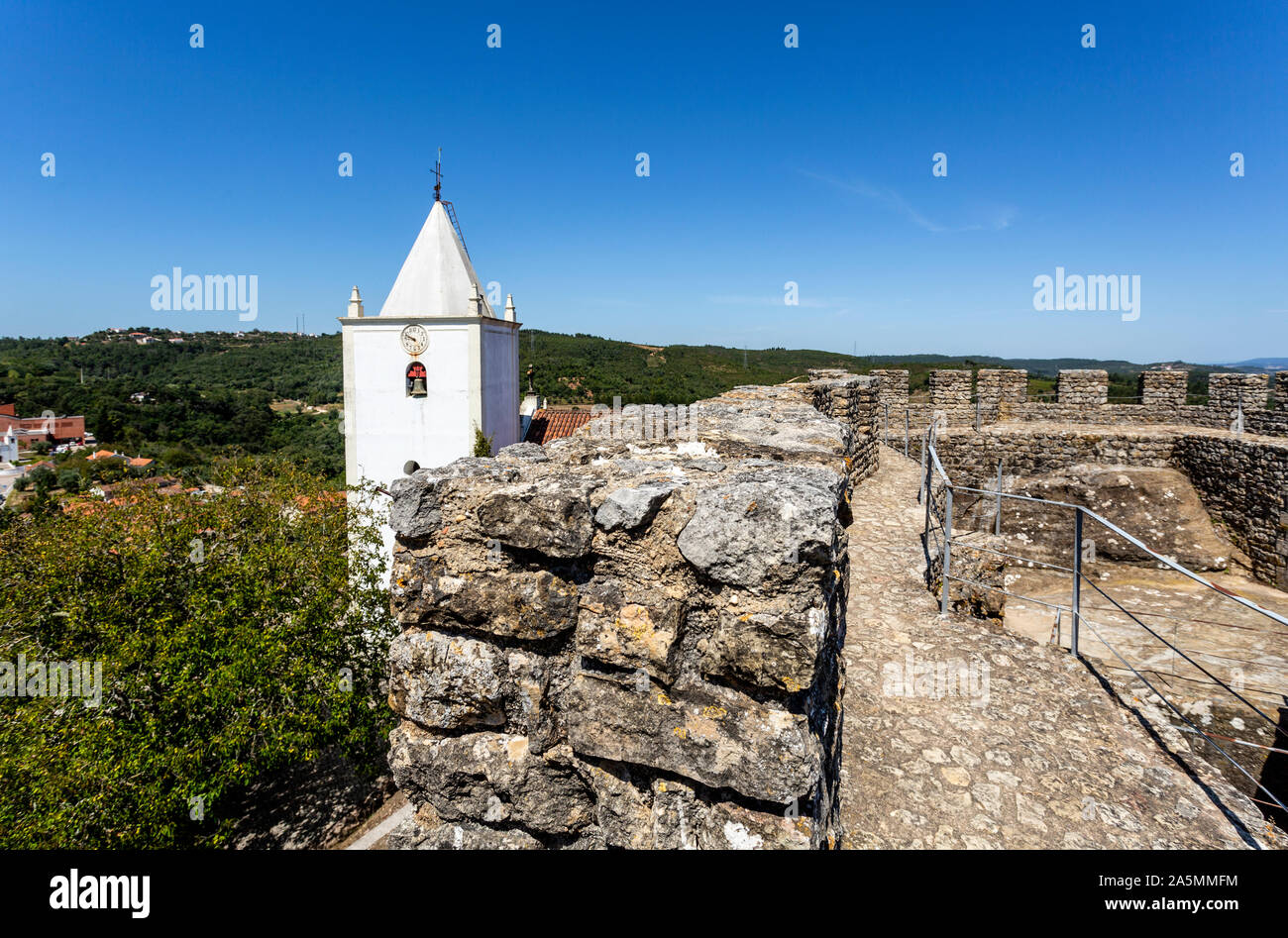 Detail of the parapet, merlons, crenels and arrow loops of the castle of Penela, built in the 12th century in Penela, Coimbra, Portugal Stock Photo