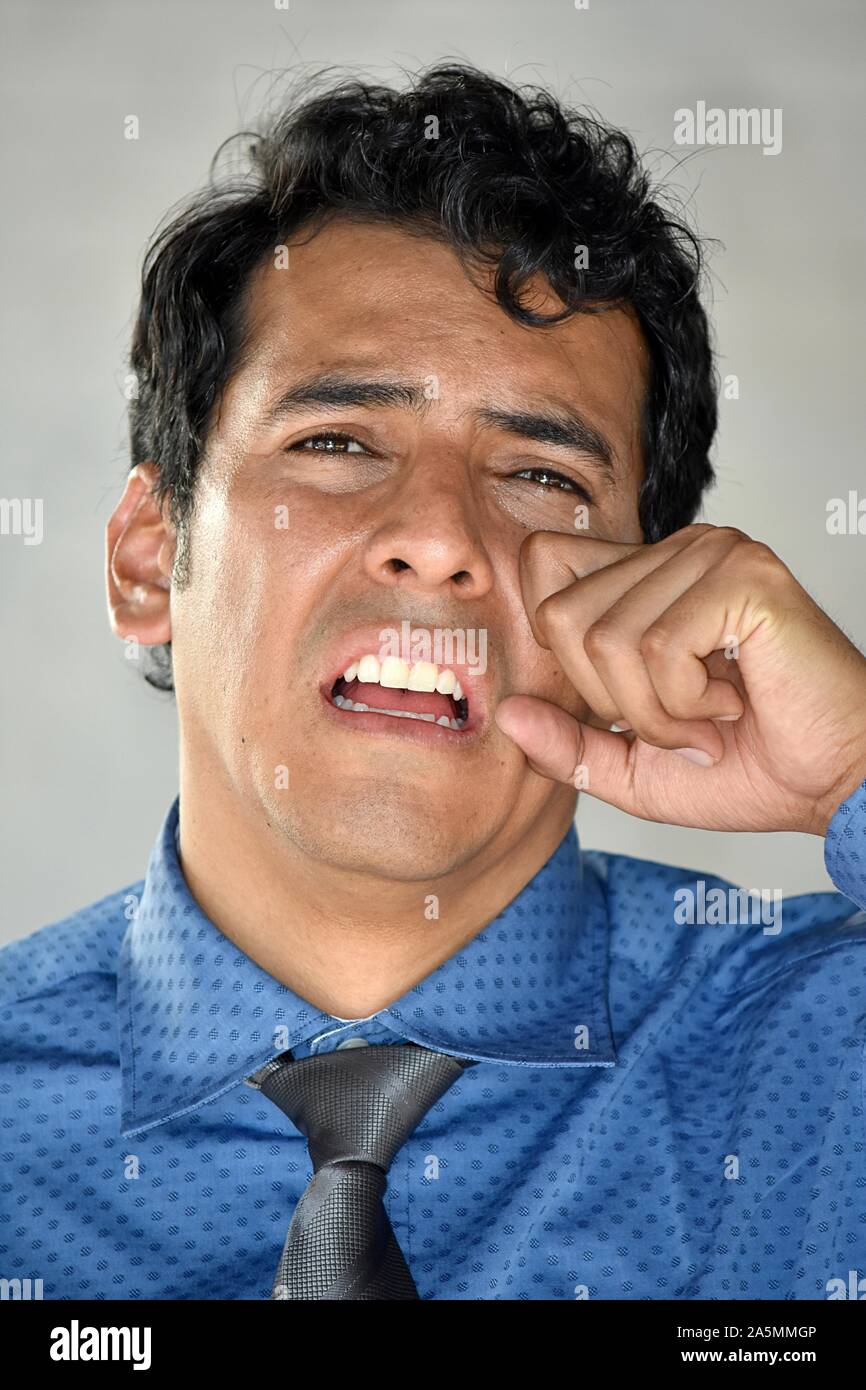 Tearful Minority Business Man Wearing Tie Stock Photo