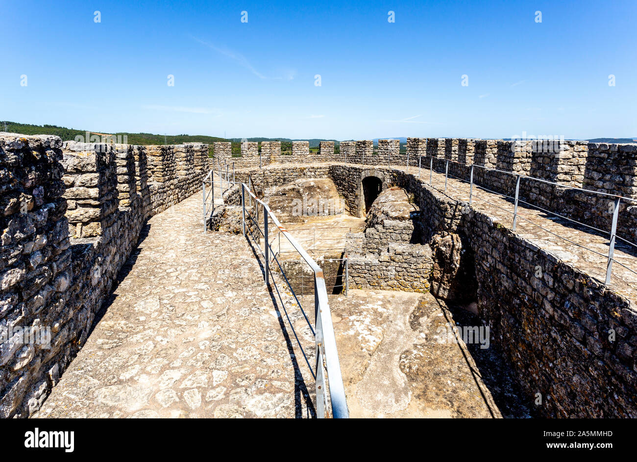 Detail of the parapet, merlons, crenels and arrow loops of the castle of Penela, built in the 12th century in Penela, Coimbra, Portugal Stock Photo
