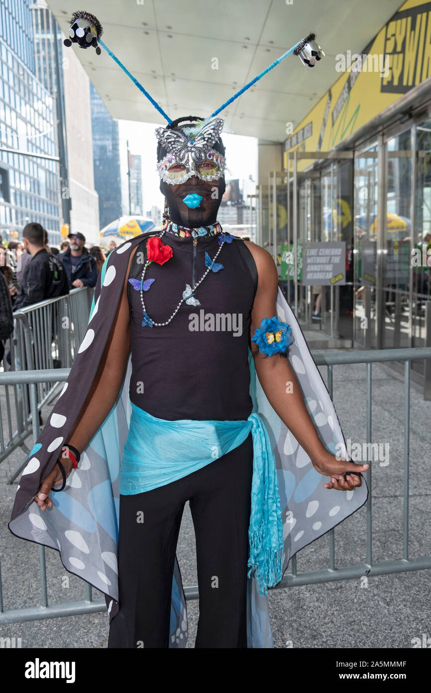 An attendee of Comic Con arriving in a costume he himself designed. In ...