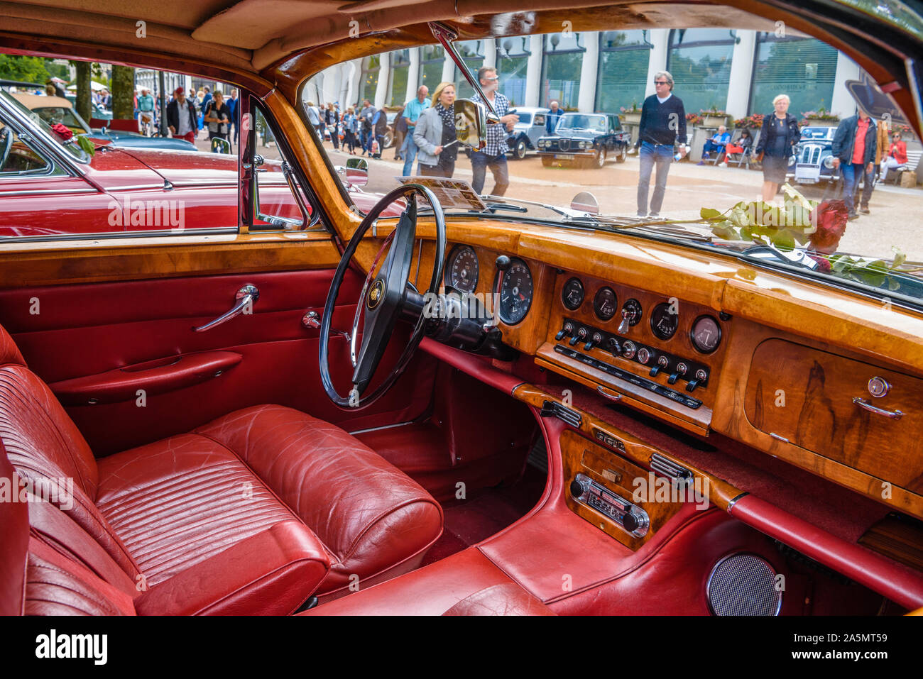 BADEN BADEN, GERMANY - JULY 2019: red leather wooden interior of JAGUAR MARK X 420G 1961 1970 sedan limousine, oldtimer meeting in Kurpark. Stock Photo