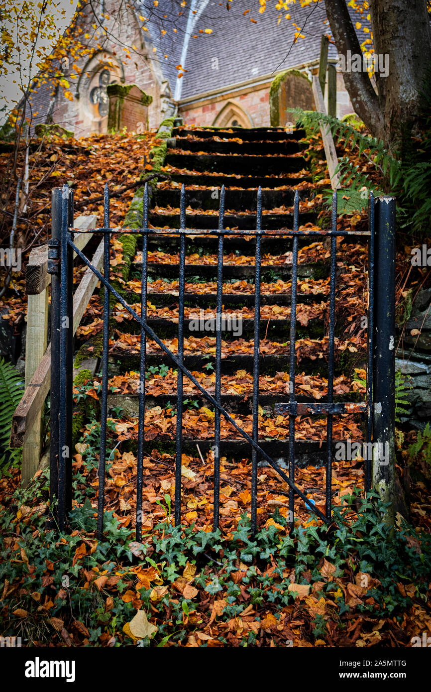 The gate leading up to Luss church, Loch Lomond Scotland. Stock Photo