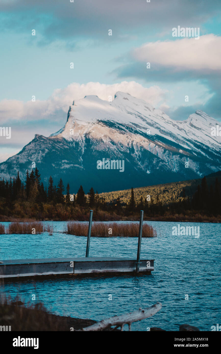 Vermillion Lake located in Banff, AB, Canada. The sunset and the mountain behind casting a shadow on Mount Rundle made the view even more scenic. Stock Photo